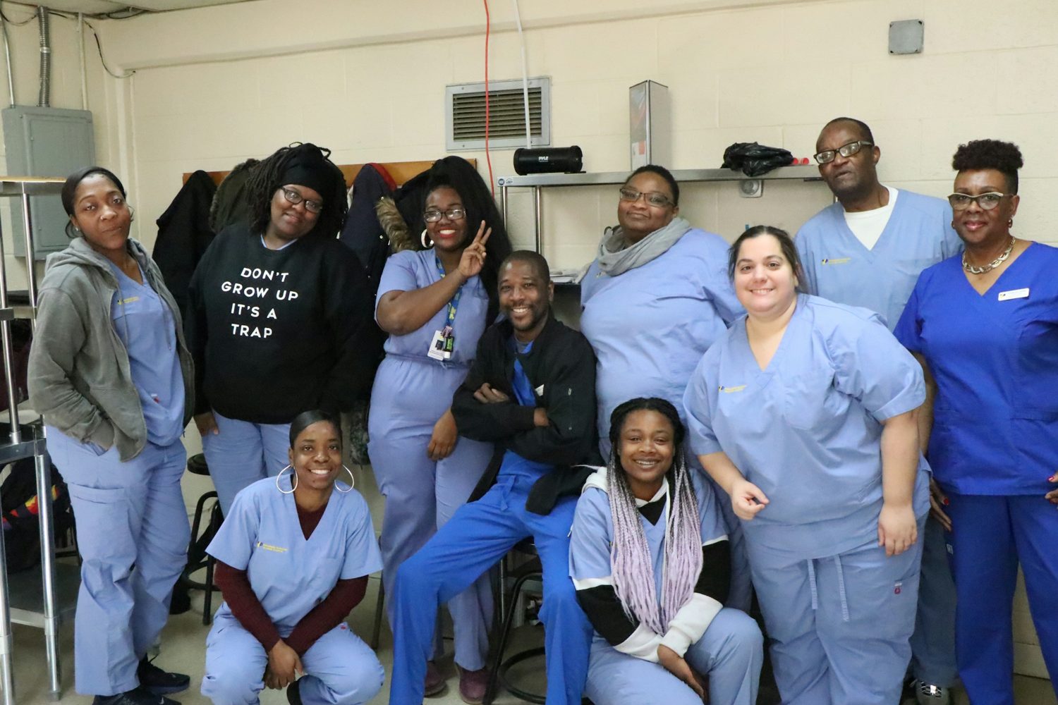 A group of health workers in scrubs